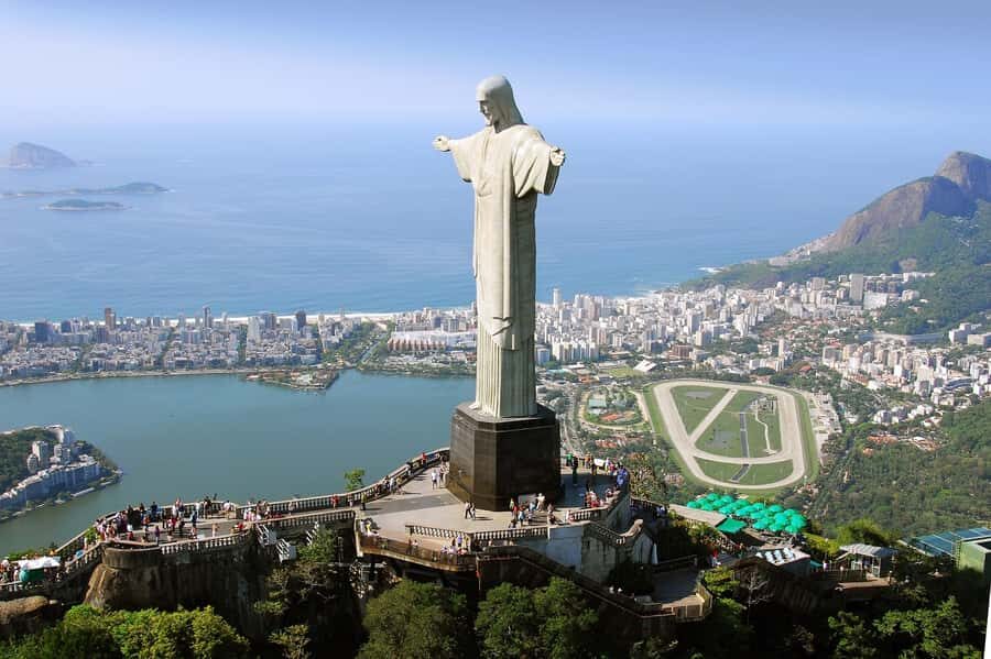 Rio: Christ Redeemer by Train & City Highlights Morning Tour - From your Rio hotel to Cosme Velho: the pickup that sets the tone